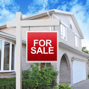 House with For Sale Sign